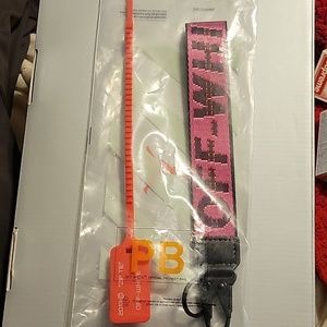Off white Caribiner with 2013 zip tie in off white product bag